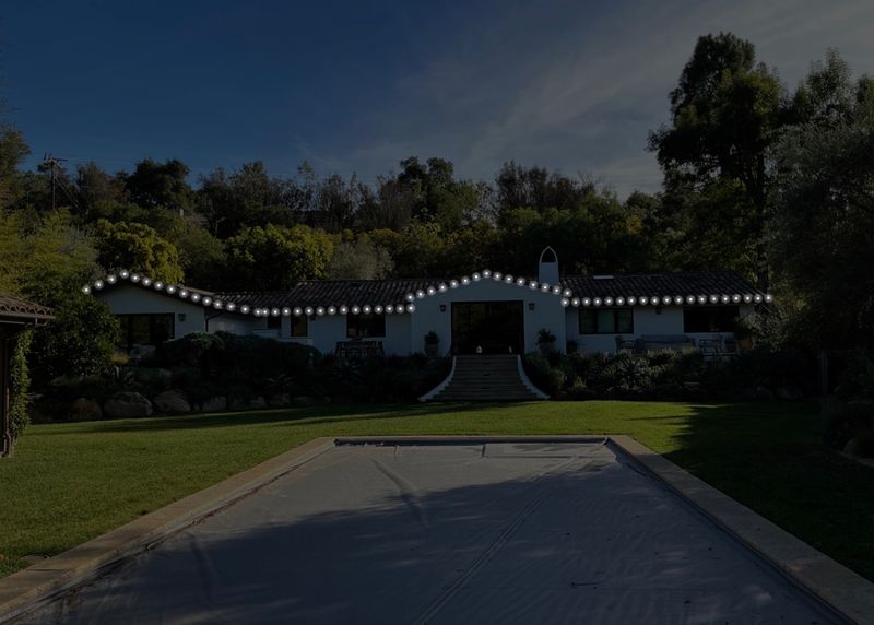 Before: a design mockup of a ranch-style home and pool at dusk, with the planned roofline lights drawn in