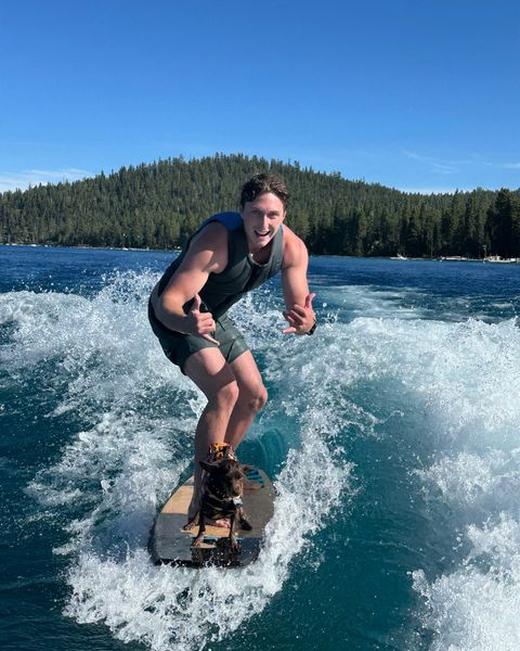 Ryan G wakeboarding on a lake